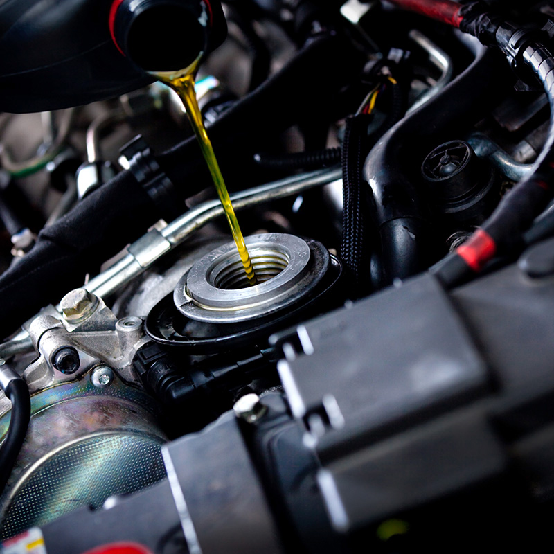 Oil Being Poured Into Car engine